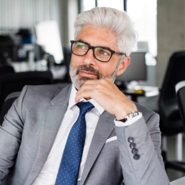 demo-attachment-169-mature-businessman-in-gray-suit-in-the-office-PSEXZSV